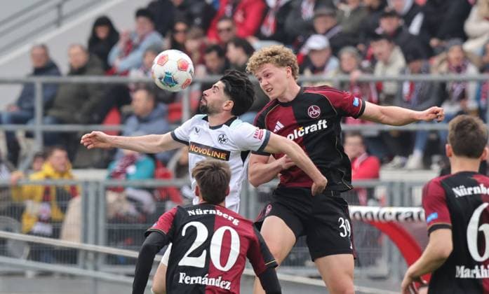 21 03 2026 Soccer Season 2025 2026 2 Soccer Bundesliga 27 Matchday 1 FC Nürnberg FCN Club 1 FC Kaiserslautern FCK Rote Roten Teufel Sportfoto Zink DaMa xdaxmax DFL regulations prohibit any use of photographs as image sequences and or quasi video only for editorial use Semih Sahin 8, 1 FC Kaiserslautern FCK in header duel with Piet Scobel 39, 1 FC Nürnberg FCN