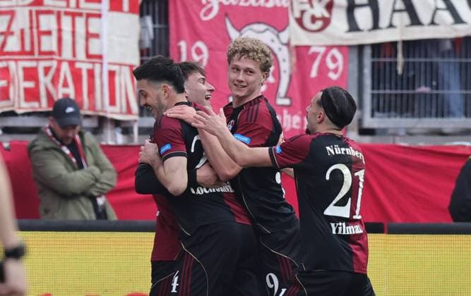 21 03 2026 Soccer Season 2025 2026 2 Soccer Bundesliga 27 Matchday 1 FC Nürnberg FCN Club 1 FC Kaiserslautern FCK Rote Roten Teufel Sportfoto Zink DaMa xdaxmax DFL regulations prohibit any use of photographs as image sequences and or quasi video only for editorial use Jubel Freude Torjubel nach Tor zum 3 0 Luka Lochoshvili 24, 1 FC Nürnberg FCN und Mannschaft Team jubelt freut sich Torschütze Luka Lochoshvili 24, 1 FC Nürnberg FCN