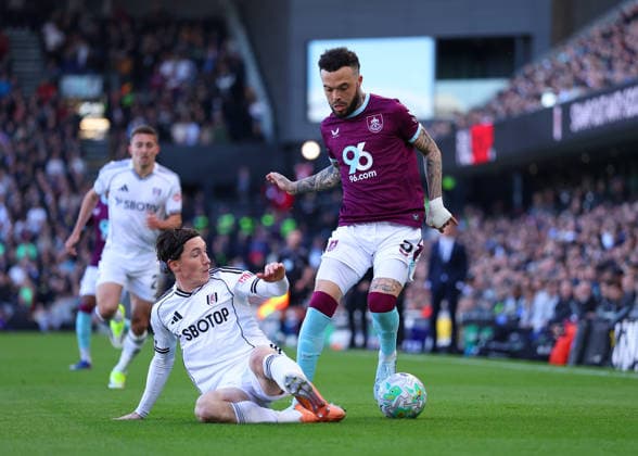 21st March 2026; Craven Cottage, Fulham, London, England; Premier League Football, Fulham versus Burnley; Quilindschy Hartman of Burnley under pressure from Harry Wilson of Fulham  JPxFletcher Content restricted for UK based newspaper