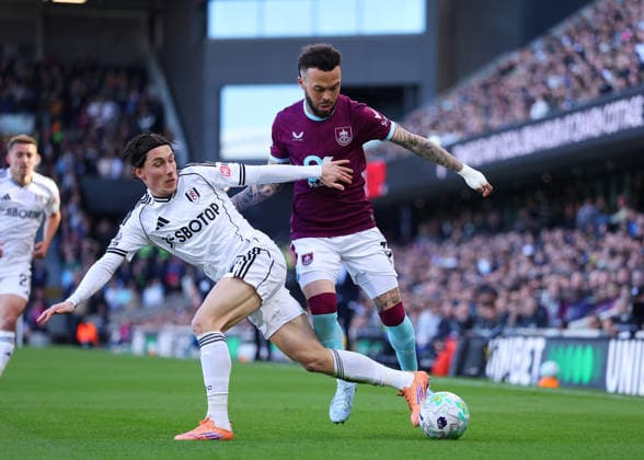21st March 2026; Craven Cottage, Fulham, London, England; Premier League Football, Fulham versus Burnley; Quilindschy Hartman of Burnley under pressure from Harry Wilson of Fulham  JPxFletcher Content restricted for UK based newspaper