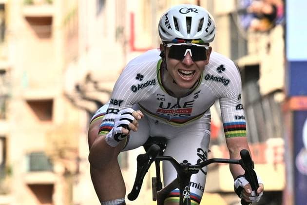 Slovenian Tadej Pogacar celebrates as he crosses the finish line to win the Milano-Sanremo one day cycling race for men, 298km from Milan to San Remo, Italy, Saturday 21 March 2026. DAVIDxPINTENS  x168471355x