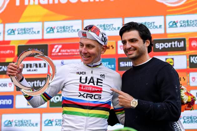 Milan Sanremo 2026 Cycling Race SANREMO, ITALY - MARCH 21 : Pogacar Tadej (SLO) of UAE Team Emirates - XRG and Carlos Sainz on the podium during the 117th edition of Milan Sanremo an UCI World Tour 1.UWT one day cycling road race for Men Elite of 298 km with start in Pavia and finish in Sanremo on March 21, 2026 in Sanremo, Italy, 21 03 2026 ( Motordriver Guy De Vuyst - Sanremo Italy  Copyright: xNicoxVereeckenx