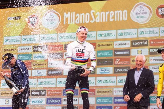 Milano Sanremo 2026 Thomas Pidcock, Tadej Pogacar, and Wout Van Aert celebrate on the podium during the champagne spraying at Via Roma in Sanremo, Italy, on March 21, 2026, during the Milano Sanremo 2026. Sanremo Italy  Copyright: xTommasoxBerardix originalFilename:berardi-milanosa260321_npOzU.jpg