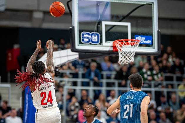 Game action with DJ Horne 0 MLP Academics Heidelberg , Cobe Williams 24 BMA365 Bamberg Baskets and Mateo Seric 21 MLP Academics Heidelberg easyCredit BBL MLP Academics Heidelberg - Bamberg Baskets Copyright: xSpeedshotx