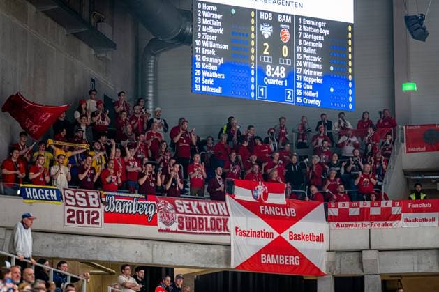 Fan scene with banners and cheering fans in the hall easyCredit BBL MLP Academics Heidelberg - Bamberg Baskets Copyright: xSpeedshotx