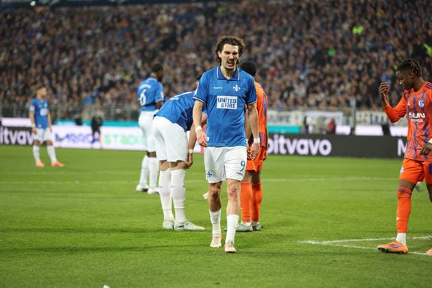 21 03 2026, xrekx, Fußball 2 Bundesliga, SV Darmstadt 98 FC Schalke 04 v l Fraser Hornby SV Darmstadt 98 enttaeuscht, enttäuscht, schaut enttaeuscht, niedergeschlagen, disappointed DFL DFB REGULATIONS PROHIBIT ANY USE OF PHOTOGRAPHS as IMAGE SEQUENCES and or QUASI VIDEO Darmstadt