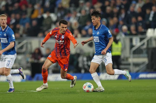 21 03 2026, Football 2 Bundesliga, SV Darmstadt 98 FC Schalke 04, v l , Dejan Ljubicic FC Schalke 04 , Hiroki Akiyama SV Darmstadt 98 DFL DFB REGULATIONS PROHIBIT ANY USE OF PHOTOGRAPHS AS IMAGE SEQUENCES AND OR QUASI VIDEO xdcx Copyright: HMBxMedia Claus