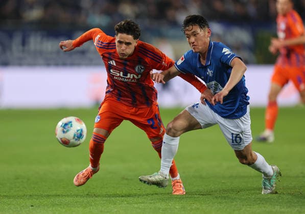 21 03 2026, Football 2 Bundesliga, SV Darmstadt 98 FC Schalke 04, v l , Soufiane El Faouzi FC Schalke 04 , Hiroki Akiyama SV Darmstadt 98 DFL DFB REGULATIONS PROHIBIT ANY USE OF PHOTOGRAPHS AS IMAGE SEQUENCES AND OR QUASI VIDEO xdcx Copyright: HMBxMedia Claus