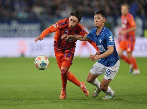 21 03 2026, Football 2 Bundesliga, SV Darmstadt 98 FC Schalke 04, v l , Soufiane El Faouzi FC Schalke 04 , Hiroki Akiyama SV Darmstadt 98 DFL DFB REGULATIONS PROHIBIT ANY USE OF PHOTOGRAPHS AS IMAGE SEQUENCES AND OR QUASI VIDEO xdcx Copyright: HMBxMedia Claus