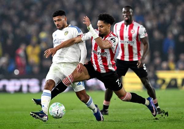 James Justin of Leeds United and Kevin Schade of Brentford Leeds v Brentford, Premier League, Football, Elland Road, Leeds, UK - 21 Mar 2026Leeds Elland Road United Kingdom EDITORIAL USE ONLY No use with unauthorised audio, video, data, fixture lists, club league logos or live services. Online in-match use limited to 120 images, no video emulation. No use in betting, games or single club league player publications. Copyright: xAnnaxGowthorpe Shutterstockx 16783311ah