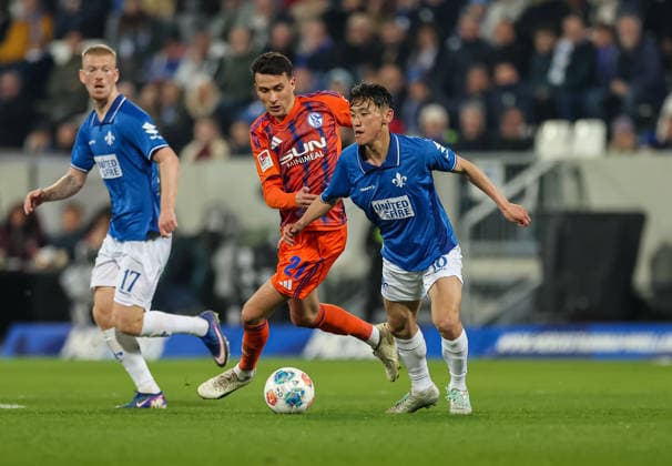 21 03 2026, Football 2 Bundesliga, SV Darmstadt 98 FC Schalke 04, v l , Dejan Ljubicic FC Schalke 04 , Hiroki Akiyama SV Darmstadt 98 DFL DFB REGULATIONS PROHIBIT ANY USE OF PHOTOGRAPHS AS IMAGE SEQUENCES AND OR QUASI VIDEO xdcx Copyright: HMBxMedia Claus