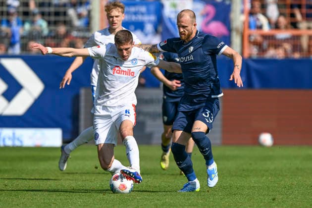 v li in duel Marko Ivezic Kiel 6 Philipp Hofmann Bochum 33 20 02 2026 ¢ Football ¢ VfL Bochum vs Holstein Kiel , Vonovia Ruhrstadion, Bochum, DFB DFL REGULATIONS PROHIBIT ANY USE OF PHOTOGRAPHS AS IMAGE SEQUENCES AND OR QUASI VIDEO Copyright: xpepphotox xHorstxMauelshagenx pep00321, pep_20260322_hm_314217