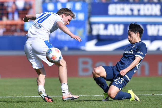 Soccer 2 Bundesliga 27 Matchday VfL Bochum Holstein Kiel on 22 02 2026 at Vonovia Ruhrstadion in Bochum Jonas Therkelsen Kiel , left Koji Miyoshi Bochum , right DFL regulations prohibit any use of photographs as image sequences and or quasi video xRx