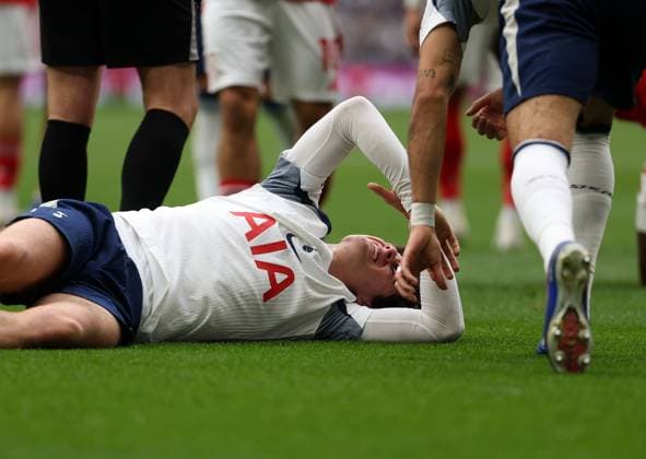 Archie Gray of Tottenham Hotspur lies injured Tottenham Hotspur v Nottingham Forest, Football, Premier League, Tottenham Hotspur Stadium, London, UK - 22 03 2026 EDITORIAL USE ONLY No use with unauthorised audio, video, data, fixture lists (outside the EU), club league logos or live services. Online in-match use limited to 45 images (+15 in extra time). No use to emulate moving images. No use in betting, games or  Copyright: xAnthonyxHanc Shutterstockx 16785849i