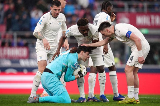 LazioÕs Edoardo Motta receives compliments from his teammates after saving a penalty kick during the Serie A soccer match between Bologna and Lazio at the Renato DallÕAra Stadium in Bologna, north Italy - Sunday, March 22, 2026 -  Copyright: xMassimoxPaolone LaPressex