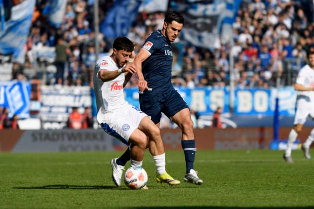 Jonas Meffert Holstein Kiel and Kjell Waetjen VfL Bochum battle for the ball during the 2 Bundesliga match between VfL Bochum and Holstein Kiel, Vonovia Ruhrstadion on March 22, 2026 in Bochum, Germany, Germany Photo by Max Maiwald DeFodi Images Jonas Meffert Holstein Kiel and Kjell Waetjen VfL Bochum battle for the ball during the 2 Bundesliga match between VfL Bochum and Holstein Kiel at Vonovia Ruhrstadion on March 22, 2026 in Bochum, Germany Photo by Max Maiwald DeFodi Images Photo by Max Maiwald DeFodi Images