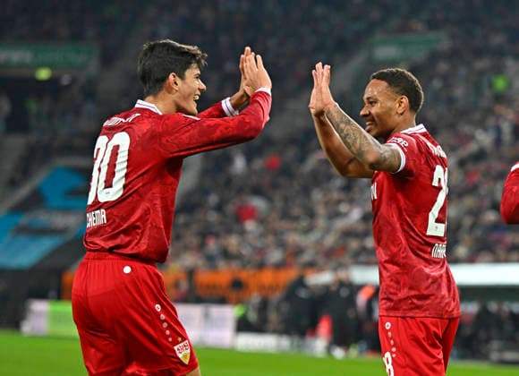 22 03 2026, Soccer 1 Bundesliga 2025 2026, Matchday 27, FC Augsburg VfB Stuttgart, in the WWK Arena Augsburg v l Chema Andres Stuttgart and Nikolas Nartey Stuttgart cheer DFL and DFB regulations prohibit any use of photographs as image sequences and or quasi video