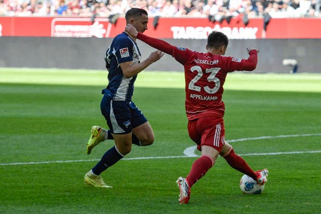 v li fighting for the ball Paul Seguin BSC 30 Shinta Appelkamp Duesseldorf 23 22 03 2026 ¢ Soccer ¢ Fortuna Duesseldorf vs Hertha BSC, Merkur Spiel Arena, Duesseldorf, DFB DFL REGULATIONS PROHIBIT ANY USE OF PHOTOGRAPHS AS IMAGE SEQUENCES AND OR QUASI VIDE Copyright: xpepphotox xSaschaxWeizx pep00321, pep_20260322_hm_316454