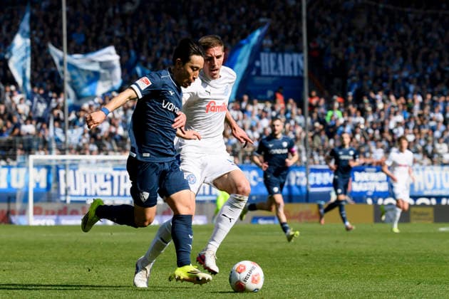 Koji Miyoshi VfL Bochum and David Zec Holstein Kiel battle for the ball during the 2 Bundesliga match between VfL Bochum and Holstein Kiel, Vonovia Ruhrstadion on March 22, 2026 in Bochum, Germany, Germany Photo by Max Maiwald DeFodi Images Koji Miyoshi VfL Bochum and David Zec Holstein Kiel battle for the ball during the 2 Bundesliga match between VfL Bochum and Holstein Kiel at Vonovia Ruhrstadion on March 22, 2026 in Bochum, Germany Photo by Max Maiwald DeFodi Images Photo by Max Maiwald DeFodi Images