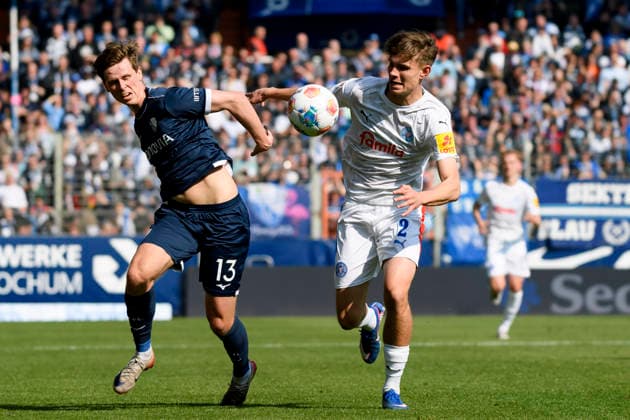 Oliver Olsen VfL Bochum and Frederik Roslyng Holstein Kiel battle for the ball during the 2 Bundesliga match between VfL Bochum and Holstein Kiel, Vonovia Ruhrstadion on March 22, 2026 in Bochum, Germany, Germany Photo by Max Maiwald DeFodi Images Oliver Olsen VfL Bochum and Frederik Roslyng Holstein Kiel battle for the ball during the 2 Bundesliga match between VfL Bochum and Holstein Kiel at Vonovia Ruhrstadion on March 22, 2026 in Bochum, Germany Photo by Max Maiwald DeFodi Images Photo by Max Maiwald DeFodi Images