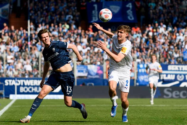 Oliver Olsen VfL Bochum and Frederik Roslyng Holstein Kiel battle for the ball during the 2 Bundesliga match between VfL Bochum and Holstein Kiel, Vonovia Ruhrstadion on March 22, 2026 in Bochum, Germany, Germany Photo by Max Maiwald DeFodi Images Oliver Olsen VfL Bochum and Frederik Roslyng Holstein Kiel battle for the ball during the 2 Bundesliga match between VfL Bochum and Holstein Kiel at Vonovia Ruhrstadion on March 22, 2026 in Bochum, Germany Photo by Max Maiwald DeFodi Images Photo by Max Maiwald DeFodi Images
