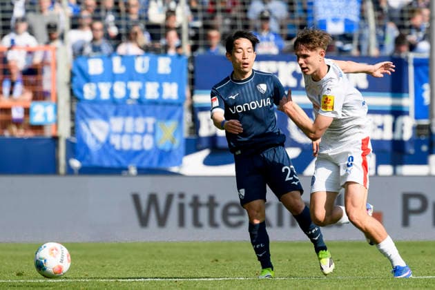 Koji Miyoshi VfL Bochum and Frederik Roslyng Holstein Kiel battle for the ball during the 2 Bundesliga match between VfL Bochum and Holstein Kiel, Vonovia Ruhrstadion on March 22, 2026 in Bochum, Germany, Germany Photo by Max Maiwald DeFodi Images Koji Miyoshi VfL Bochum and Frederik Roslyng Holstein Kiel battle for the ball during the 2 Bundesliga match between VfL Bochum and Holstein Kiel at Vonovia Ruhrstadion on March 22, 2026 in Bochum, Germany Photo by Max Maiwald DeFodi Images Photo by Max Maiwald DeFodi Images
