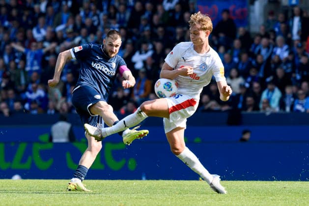 Matus Bero VfL Bochum and Kasper Davidsen Holstein Kiel battle for the ball during the 2 Bundesliga match between VfL Bochum and Holstein Kiel, Vonovia Ruhrstadion on March 22, 2026 in Bochum, Germany Photo by Max Maiwald DeFodi Images Matus Bero VfL Bochum and Kasper Davidsen Holstein Kiel battle for the ball during the 2 Bundesliga match between VfL Bochum and Holstein Kiel at Vonovia Ruhrstadion on March 22, 2026 in Bochum, Germany Photo by Max Maiwald DeFodi Images Photo by Max Maiwald DeFodi Images