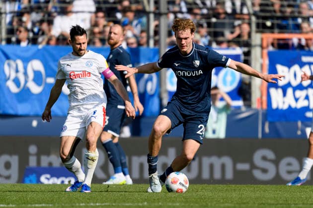 Phil Harres Holstein Kiel and Mats Pannewig VfL Bochum battle for the ball during the 2 Bundesliga match between VfL Bochum and Holstein Kiel, Vonovia Ruhrstadion on March 22, 2026 in Bochum, Germany Photo by Max Maiwald DeFodi Images Phil Harres Holstein Kiel and Mats Pannewig VfL Bochum battle for the ball during the 2 Bundesliga match between VfL Bochum and Holstein Kiel at Vonovia Ruhrstadion on March 22, 2026 in Bochum, Germany Photo by Max Maiwald DeFodi Images Photo by Max Maiwald DeFodi Images