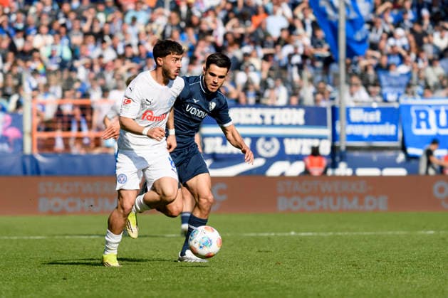 Jonas Meffert Holstein Kiel and Kjell Waetjen VfL Bochum battle for the ball during the 2 Bundesliga match between VfL Bochum and Holstein Kiel, Vonovia Ruhrstadion on March 22, 2026 in Bochum, Germany, Germany Photo by Max Maiwald DeFodi Images Jonas Meffert Holstein Kiel and Kjell Waetjen VfL Bochum battle for the ball during the 2 Bundesliga match between VfL Bochum and Holstein Kiel at Vonovia Ruhrstadion on March 22, 2026 in Bochum, Germany Photo by Max Maiwald DeFodi Images Photo by Max Maiwald DeFodi Images