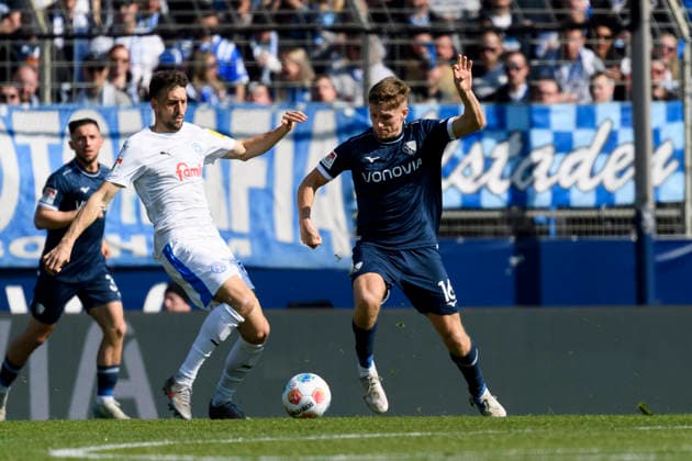 Jonas Meffert Holstein Kiel and Callum Marshall VfL Bochum battle for the ball during the 2 Bundesliga match between VfL Bochum and Holstein Kiel, Vonovia Ruhrstadion on March 22, 2026 in Bochum, Germany, Germany Photo by Max Maiwald DeFodi Images Jonas Meffert Holstein Kiel and Callum Marshall VfL Bochum battle for the ball during the 2 Bundesliga match between VfL Bochum and Holstein Kiel at Vonovia Ruhrstadion on March 22, 2026 in Bochum, Germany Photo by Max Maiwald DeFodi Images Photo by Max Maiwald DeFodi Images