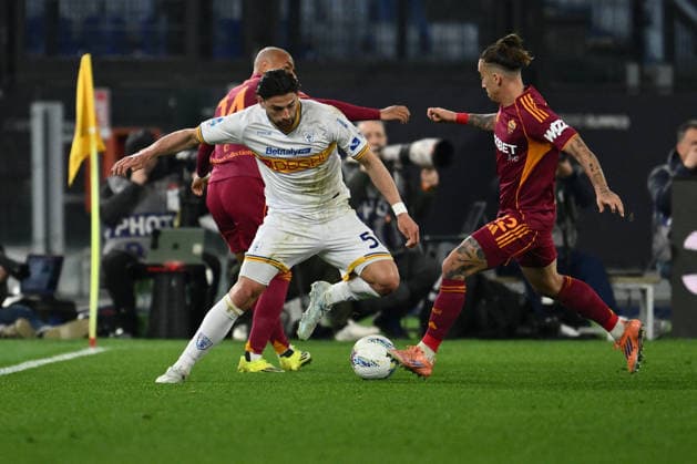 CALCIO - Serie A - AS Roma vs US Lecce Santiago Pierotti of U.S. Lecce and Kostas Tsimikas of A.S. Roma are in action during the 30th day of the Serie A Championship between A.S. Roma and U.S. Lecce at the Olympic Stadium on March 22, 2026 in Rome, Italy. Roma Italy  Copyright: xIPAxSport ABACAx