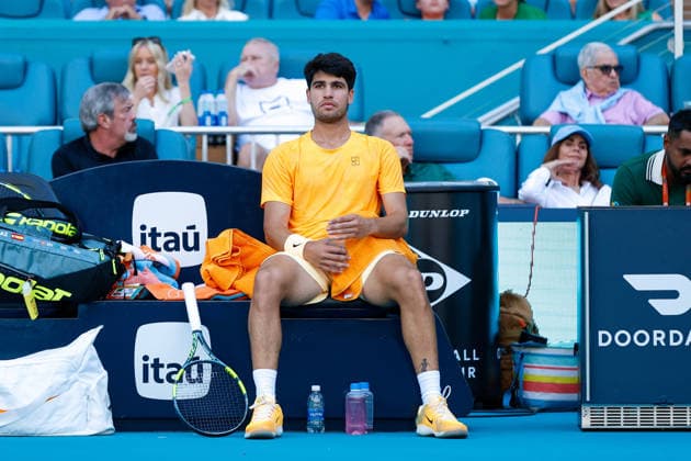 MIAMI GARDENS, FL - MARCH 22: Carlos Alcaraz (ESP) looks on during his men™s third round singles match against Sebastian Korda (USA) at the Miami Open on March 22, 2026, at Hard Rock Stadium in Miami Gardens, Florida,(Photo by Chris Arjoon Icon Sportswire) TENNIS: MAR 22 Miami Open EDITORIAL USE ONLY Icon2603220010097