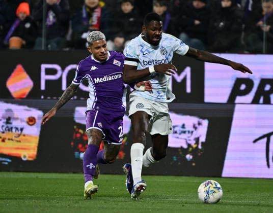 (260323) -- FLORENCE, March 23, 2026 () -- Inter Milan s Marcus Thuram (R) vies with Fiorentina s Dodo during a Serie A football match between Fiorentina and Inter Milan in Florence, Italy, March 22, 2026. () (SP)ITALY-FLORENCE-FOOTBALL-SERIE A-FIORENTINA VS INTER MILAN Xinhua 