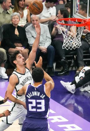 (260323) -- SACRAMENTO, March 23, 2026 -- Ben Saraf of Brooklyn Nets goes for a layup during the 2025-2026 NBA, Basketball Herren, USA regular season game between Sacramento Kings and Brooklyn Nets in Sacramento, the United States, March 22, 2026. (Photo by Xinhua) (SP)U.S.-SACRAMENTO-BASKETBALL-NBA-KINGS VS NETS SunxYuxuan 