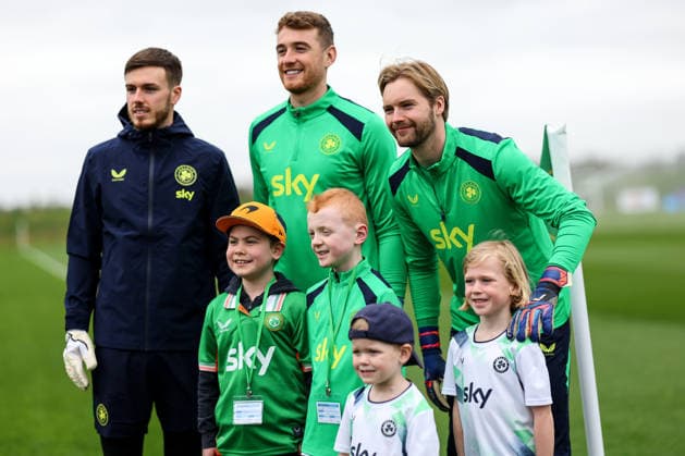 Republic of Ireland Squad Training, FAI HQ, Dublin 23 3 2026 Joshua Keeley, Mark Travers and Caoimhin Kelleher pose with young fans Joshua Keeley, Mark Travers and Caoimhin Kelleher pose with young fans 23 3 2026  Copyright: x INPHO RyanxByrnex RB2_1191