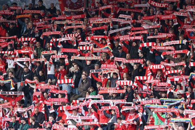 The fans of 1 FC Union Berlin show their fan scarves in the fan block of the home fans, holding up scarves, fans, spectators, symbolic photo, symbolic image football, soccer, symbol, THE DFB GUIDELINES PROHIBIT ANY USE OF PHOTOGRAPHS AS IMAGE SEQUENCES AND OR QUASI VIDEO DFB REGULATIONS PROHIBIT ANY USE OF PHOTOGRAPHS AS IMAGE SEQUENCES AND OR QUASI VIDEO , 23 03 2026, Berlin Germany , Football, Google Pixel Women Bundesliga, 1 FC Union Berlin SV Werder Bremen xobx