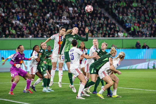 Camilla Küver VfL Wolfsburg,16 vs Damaris Egurrola OL Lyonnes Lyon,13 Womens Champions League quarter-final season 2025 2026 VfL Wolfsburg vs OL Lyonnes Lyon at the Volkswagen Arena in Wolfsburg Action,soccer,woman,women,ladies,Germany,24 03 2026