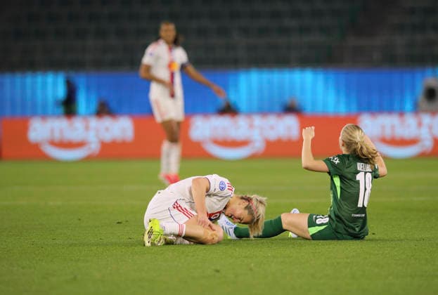 Photo Lindsey HEAPS Lyon goes down against Justine KIELLAND Wolfsburg Football Womens Champions League on Tue 24 03 2026 Quarterfinal VfL Wolfsburg Olympique Lyon