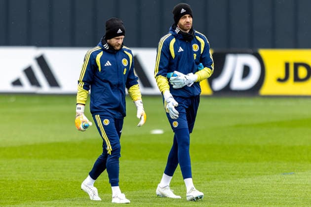 Scotland Training Angus Gunn of Scotland national team, Nationalteam walks onto the pitch alongside Scott Bain during the Scotland training session ahead of their International Challenge Match, Scotland vs Japan, Lesser Hampden, Hampden Park, Glasgow, Scotland, 25 03 2026. Hampden Park Lesser Hampden Glasgow Scotland Editorial use only , Copyright: xColinxPoultneyx PSI-23967-0049
