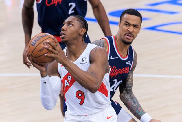 March 25, 2026, Inglewood, California, USA: RJ Barrett 9 of the Toronto Raptors drives past John Collins 20 of the Los Angeles Clippers during regular season NBA, Basketball Herren, USA game on Wednesday March 25, 2026 at Intuit Dome in Inglewood, California. ARIANA RUIZ PI Clippers Vs. Raptors  - ZUMAp124 20260325_zaa_p124_017 Copyright: xArianaxRuizx