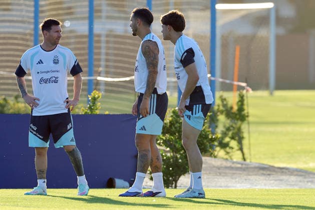 Argentina™s forward Lionel Messi L talks with his teammate midfielder Leandro Paredes during a training session in Ezeiza, Buenos Aires Province, on March 25, 2026, ahead of the FIFA World Cup 2026 friendly football matches against Mauritania and Zambia EZEIZA ARGENTINA Copyright: xALEJANDROxPAGNIx
