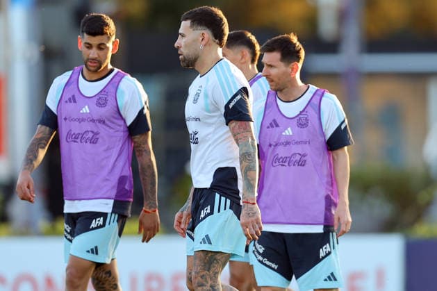Argentina s forward Lionel Messi R chats with his teammates defenders Cristian Romero L and Nicolas Otamendi during a training session in Ezeiza, Buenos Aires Province, on March 25, 2026, ahead of the FIFA World Cup 2026 friendlys football matches against Mauritania and Zambia EZEIZA ARGENTINA Copyright: xALEJANDROxPAGNIx