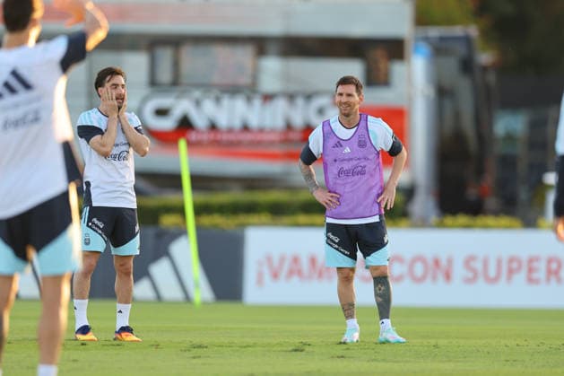 Argentina s forward Lionel Messi R gestures next his teammate defender Nicolas Tagliafico L during a training session in Ezeiza, Buenos Aires Province, on March 25, 2026, ahead of the FIFA World Cup 2026 friendlys football matches against Mauritania and Zambia EZEIZA ARGENTINA Copyright: xALEJANDROxPAGNIx