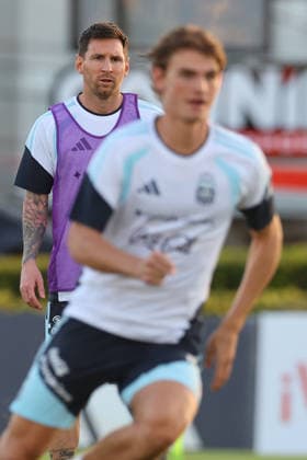 Argentine forward Lionel Messi gestures behind fellow forward Nicolas Paz out of focus during a training session in Ezeiza, Buenos Aires Province, on March 25, 2026, ahead of the 2026 FIFA World Cup friendly matches against Mauritania and Zambia EZEIZA ARGENTINA Copyright: xALEJANDROxPAGNIx