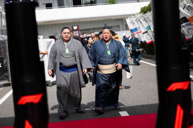 March 26, 2026, Suzuka, Mie, Japan: Sumo wrestlers visiting the paddock on media day for the 2026 Formula 1 Japanese Grand Prix. Formula 1 is one of the most logistically complicated sporting events in the world and the price of motorsport logistics has been affected by the US-Iran warÃ¢â‚¬â ¢s impact on air freight shipping lanes and oil prices. F1 2026: Japan - Media Day  - ZUMAb177 20260326_aap_b177_053 Copyright: xTaidghxBarronx