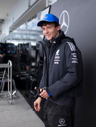 March 26, 2026, Suzuka, Mie, Japan: KIMI ANTONELLI of Mercedes receives a bottle of Yamazaki whisky from a fan after signing autographs in the paddock ahead of the Formula 1 Japanese Grand Prix at Suzuka Circuit. Suzuka Japan - ZUMAh201 20260326_zsp_h201_035 Copyright: xYichinxHoux