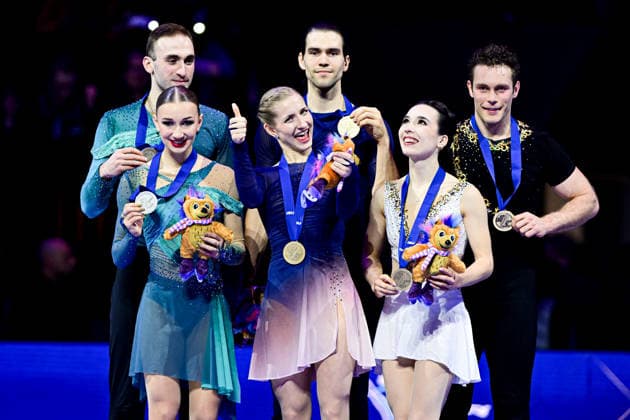 Pairs Awards, L-R, Anastasiia METELKINA & Luka BERULAVA (GEO) second place, Minerva Fabienne HASE & Nikita VOLODIN (GER) first place, Lia PEREIRA & Trennt MICHAUD (CAN) third place, during Victory Ceremony, at the ISU Figure skating, Eiskunstlauf World Championships 2026, at O2 Arena, on March 26, 2026 in Prague, Czechia. Noxthirdxpartyxsales  aflo_324980276