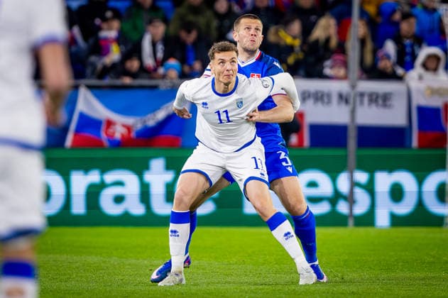 SLOVAKIA - KOSOVO Denis Vavro of Slovakia and VfL Wolfsburg and Fisnik Asllani of Kosovo and TSG Hoffenheim during the knockout (KO) play off of FIFA World Cup, WM, Weltmeisterschaft, Fussball 2026 WM, Weltmeisterschaft, Fussball WM, Weltmeisterschaft, Fussball qualification football match between Slovakia and Kosovo. Narodny futbalovy stadion, National football stadium, Tehelne Pole, Bratislava, Slovakia, March 26, 2026. Photo by Branislav Racko Copyright: xx 080A1972