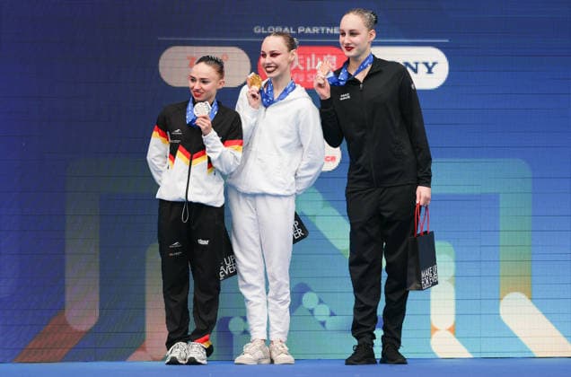 (260327) -- PARIS, March 27, 2026 -- Gold medalist Vasilina Khandoshka (C) of neutral athletes A (NAA), silver medalist Klara Bleyer (L) of Germany and bronze medalist Valeriia Plekhanova of neutral athletes B (NAB) react during the awarding ceremony after the women s solo technical final at the World Aquatics Artistic Swimming World Cup 2026 - Stop 2 in Paris, March 27, 2026. ) (SP)FRANCE-PARIS-ARTISTIC SWIMMING-WORLD AQUATICS-WORLD CUP WuxHuiwo 
