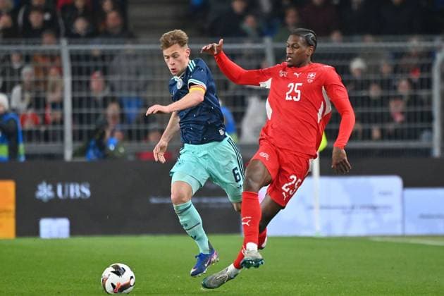 Joshua KIMMICH (GER), Aktion,Zweikampf gegen Joel MONTEIRO (SUI). Fussball Laenderspiel Schweiz -Deutschland 3-4 am 27.03.2026 St. Jakob Park Basel *** Joshua KIMMICH GER , action,duel against Joel MONTEIRO SUI Soccer international Switzerland Germany 3 4 on 27 03 2026 St Jakob Park Basel